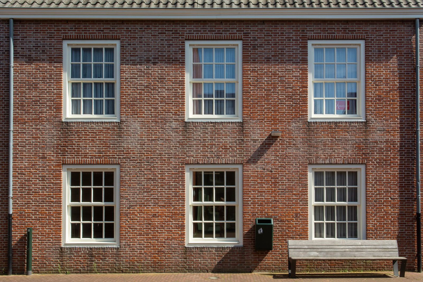 A brick house with sash windows typical of cavity-wall construction